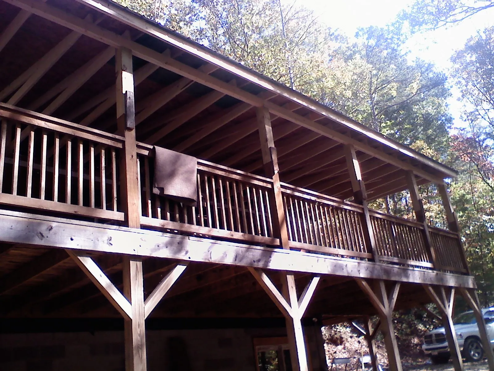 Timber framing under a new elevated porch and deck — Roof Leak Repair in Fishers Island by Roofing Brothers